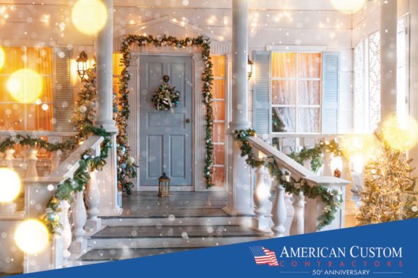 Picture of a front door with white Christmas lights and festive greens