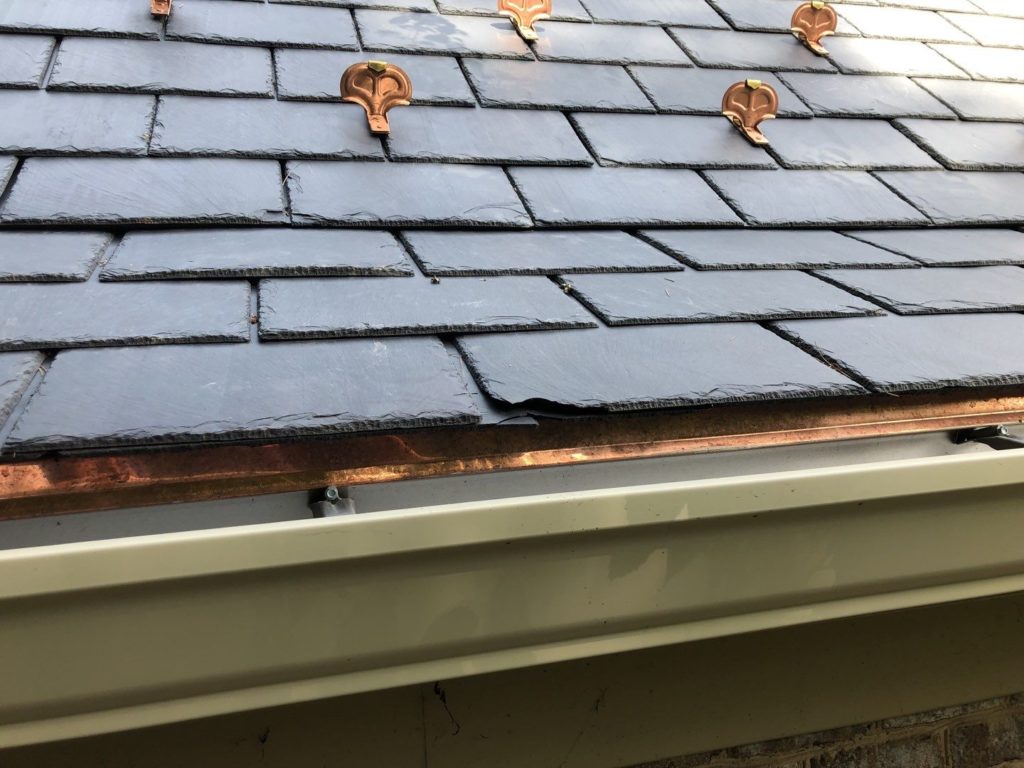 Slate roof with copper snow guards