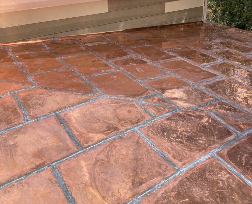 This image is a close up of a custom hand sawdered copper flat roof.
