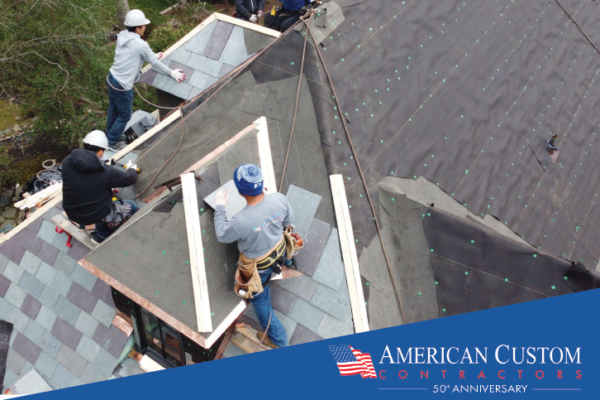 Picture of 3 roofers replacing a multi-color Vermont slate roof. 