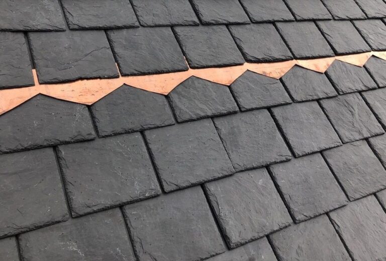 The image is a custom copper accent that was installed by American Custom Contractors when we installed a natural Spanish slate in non-fading black.