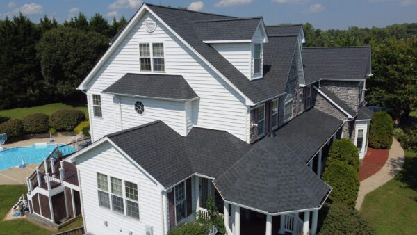 Victorian style home located in Huntingtown MD, featuring a new GAF Charcoal color roof system and custom white gutters