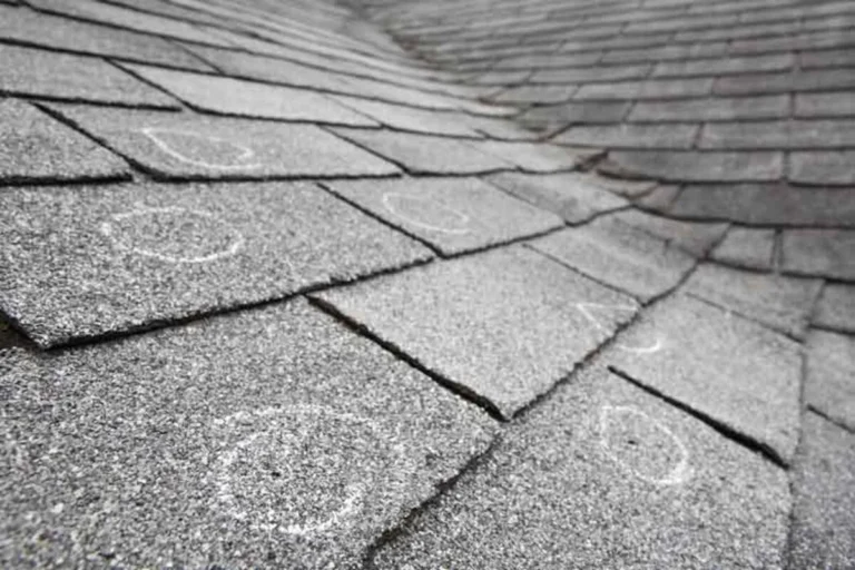 damaged gray asphalt roof