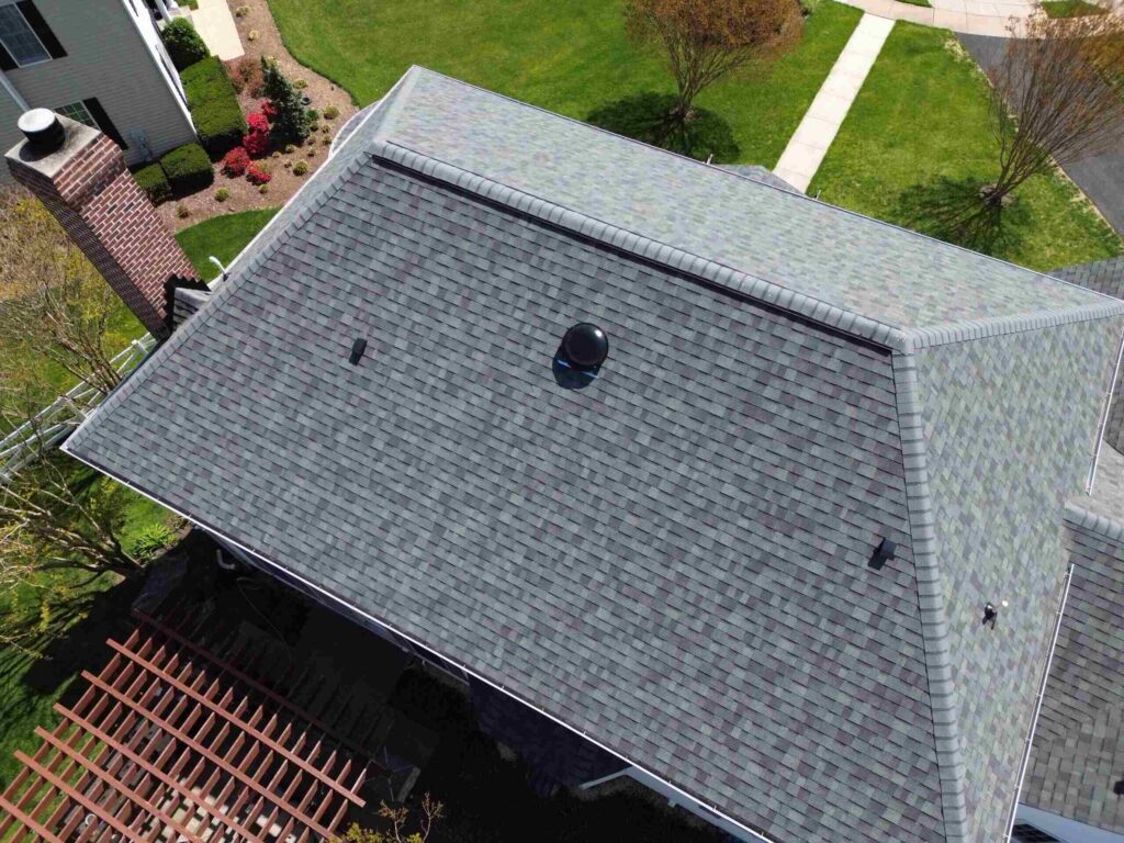 Close-up of a newly installed Owens Corning roof shingle on a home in Middletown, MD. The picture features a lovely shingle in the color Sierra Gray. American Custom Contractors holds a Platinum Preferred Owens Corning roof contractor certification.
