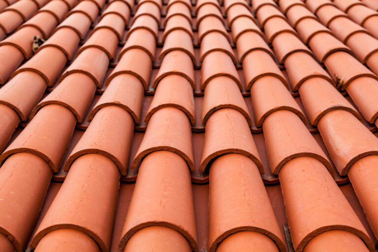 Close-up picture of rows of natural Spanish clay tiles installed on the Greek Orthodox Church in Bethesda, MD by American Custom Contractors.
